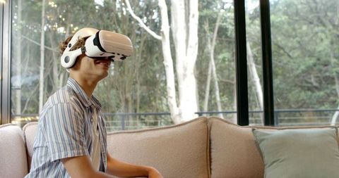 Man Experiencing Virtual Reality Technology at Home