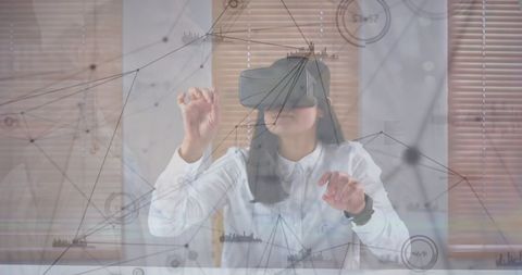 Businesswoman Engaging with Digital Interfaces Using VR Technology
