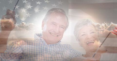 Joyful Senior Couple Celebrating with American Flags