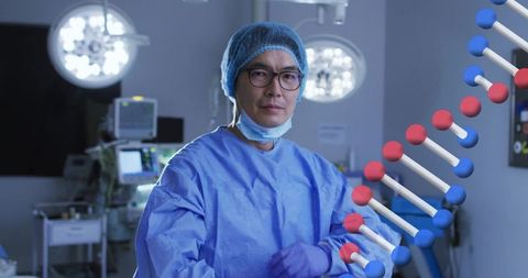 Surgeon standing in operating room wearing blue gown and gloves with dna helix overlay