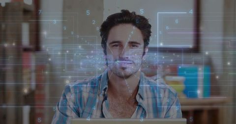 Male professional engaging virtually with futuristic data at home office