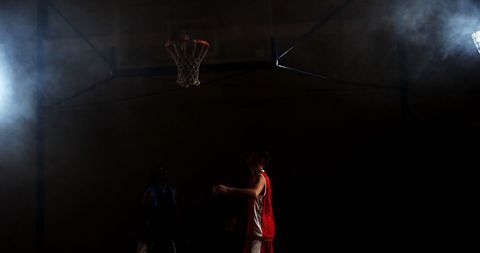 Intense Basketball Game Indoor Under Dramatic Lighting - Download Free Stock Images Pikwizard.com