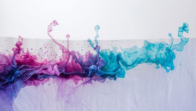 Flowing magenta to turquoise ink ribbon creating fluid tendrils on textured paper