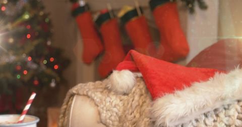 Cozy Christmas Scene with Stockings and Hot Chocolate