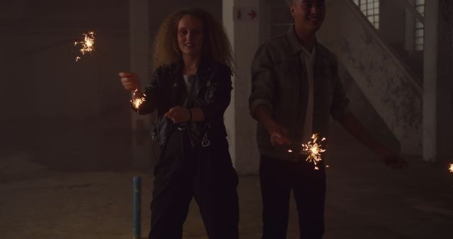 Young Friends Celebrating with Sparklers in Urban Setting at Night - Download Free Stock Images Pikwizard.com