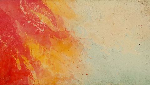 Abstract red and orange paint splash mixing into pale blue textured grunge background
