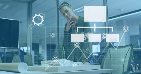 Pensive Designer Analyzing Data with Graphical Interface Overlay - Download Free Stock Images Pikwizard.com