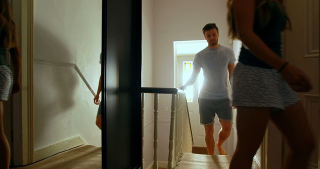 Group of Friends Walking Upstairs in Bright Modern Home - Download Free Stock Images Pikwizard.com