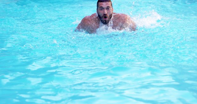 Man swimming in blue pool on sunny day - Download Free Stock Images Pikwizard.com