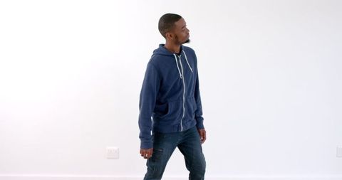 Young Man Wearing Blue Hoodie Looking Confident Indoors - Download Free Stock Images Pikwizard.com