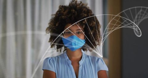 Standing healthcare professional wearing blue mask and glasses with airflow data overlay
