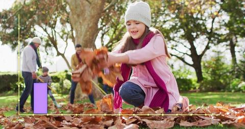 Girl playing in autumn leaves with family, tossing leaves, purple overlay and markers