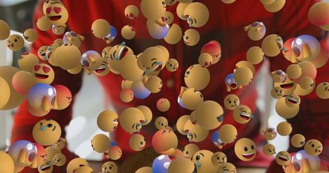 Man Surrounded by Playful 3D Emojis in Vibrant Living Room