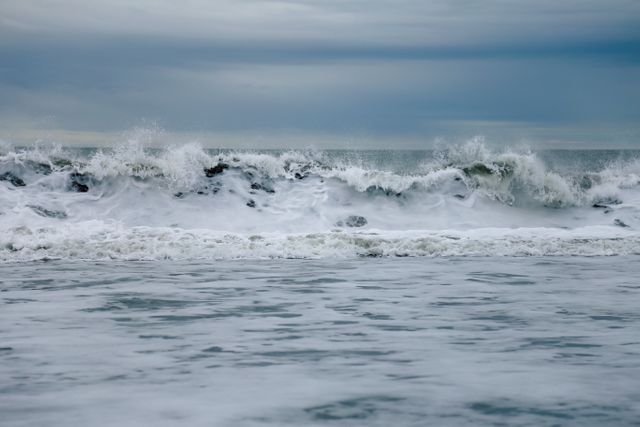 Waves Crashing on Stormy Ocean With Cloudy Sky - Download Free Stock Photos Pikwizard.com