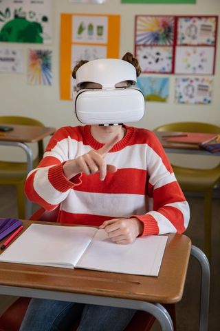 Adolescent student engaging in learning with vr headset