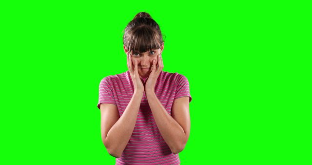Shocked Woman in Striped T-Shirt with Green Screen Background - Download Free Stock Images Pikwizard.com