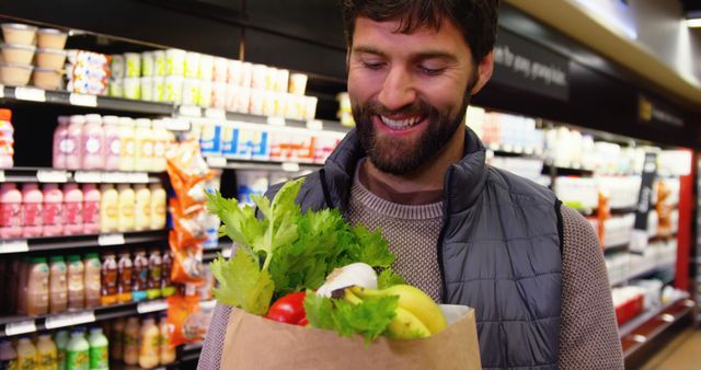 Smiling Man Shopping for Fresh Vegetables in Supermarket - Download Free Stock Images Pikwizard.com