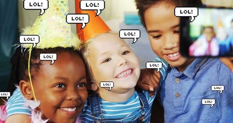 Children Sharing Laughs at Birthday Party with Smartphone