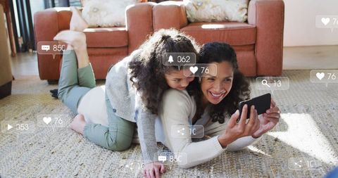 Mother and Daughter Enjoying Social Media on Smartphone