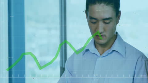 Asian Businessman Analyzing Digital Data with Tablet in Modern Office