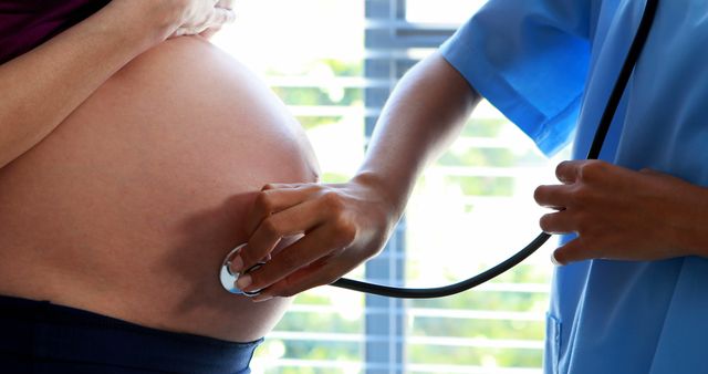 Pregnant Woman Receiving Prenatal Checkup from Healthcare Professional - Download Free Stock Images Pikwizard.com