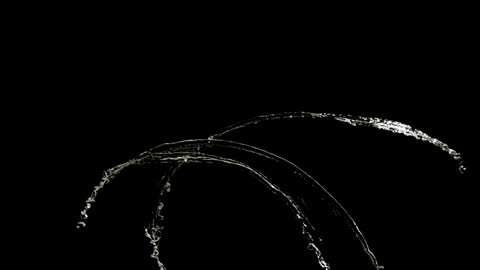 Elegant Arches of Water in Super Slow Motion Against Black Background