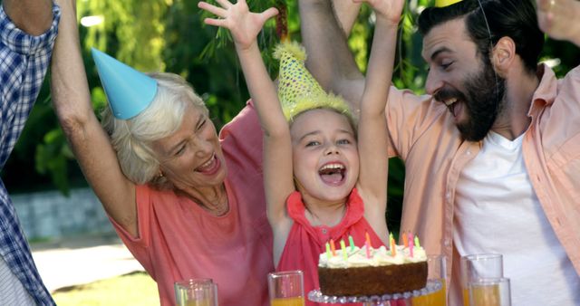 Multi-generational Family Celebrating Birthday Outdoors with Joy - Download Free Stock Images Pikwizard.com