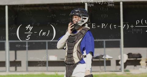 Catcher Wearing Gear on Field with Math Formulas Overlay