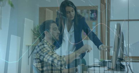 Business professionals analyzing financial data on computer screens