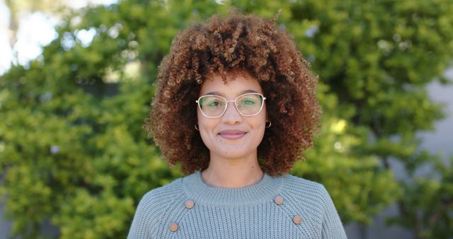 Smiling Woman with Curly Hair Poses Outdoors - Download Free Stock Images Pikwizard.com