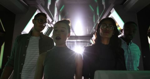 Young professionals collaborating in high-tech environment