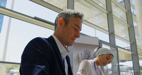 Diverse Business Professionals Engaging in Seminar Activities