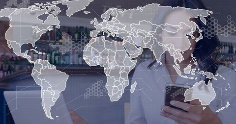 Remote work connectivity woman holding smartphone and laptop with global map overlay