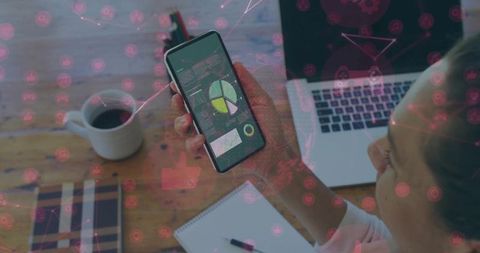 Businesswoman Analyzing Smartphone Data in Home Office Setting