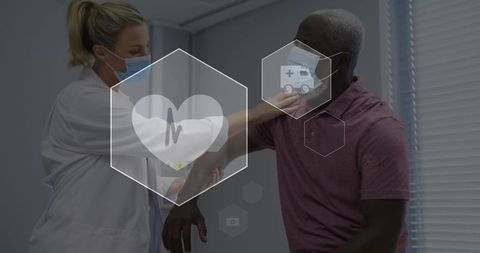 Clinician examining patient arm during medical checkup with healthcare icons overlay