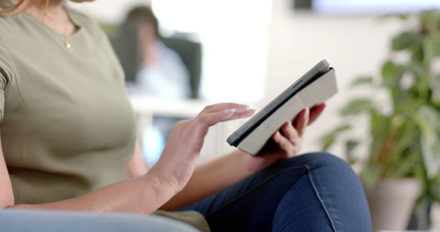 Person Using Digital Tablet at Home in Casual Setting - Download Free Stock Images Pikwizard.com