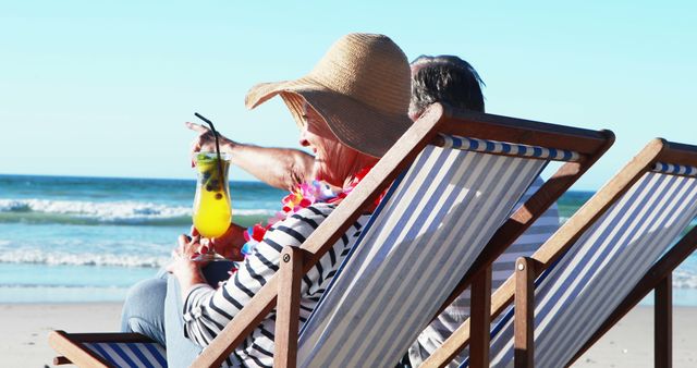 Seniors Relaxing on Beach Chairs with Tropical Drinks - Download Free Stock Images Pikwizard.com