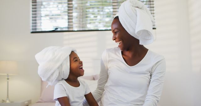 Happy Mother and Daughter in Bathroom with Towels on Heads - Download Free Stock Images Pikwizard.com