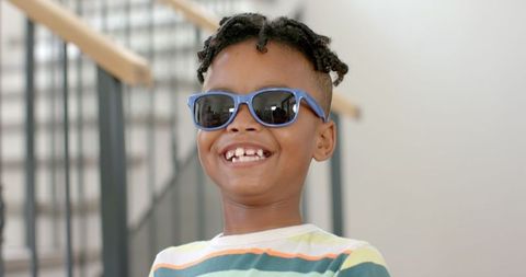 Joyful Boy with Sunglasses and Striped Shirt, Lifestyle Moment