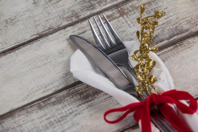 Elegant Cutlery Wrapped in Napkin with Red Ribbon - Download Free Stock Photos Pikwizard.com