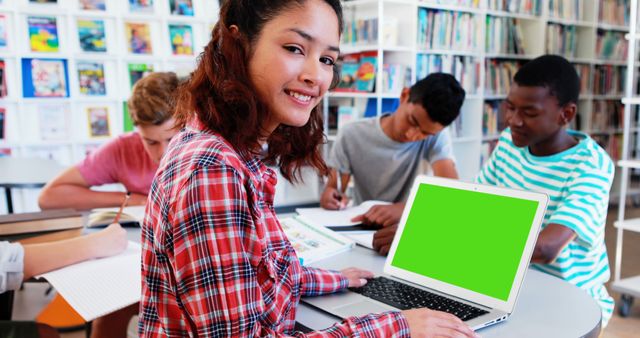 Teenage Students Studying Together in Library with Laptops and Books - Download Free Stock Images Pikwizard.com