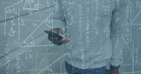 Mathematical Data Overlaying Businessman with Smartphone