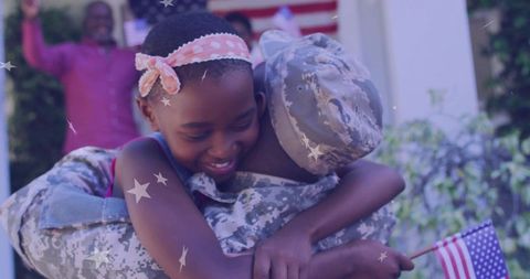 Reunited Military Father embracing Daughter in Outdoor American Celebration