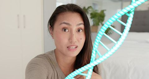 Mid-adult woman vlogging about dna and genetics with teal helix overlay