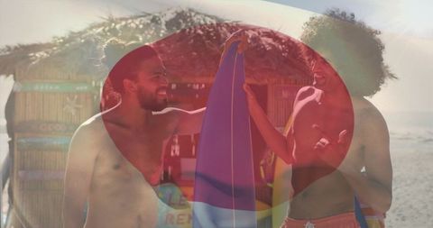 Laughing friends holding colorful surfboard on sunny beach with heart-shaped overlay