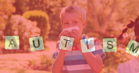 Autism awareness concept with sneezing child outdoors