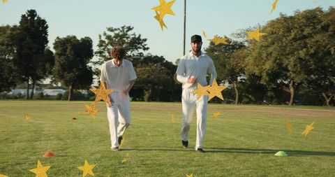 Two cricketers jogging during training session with gold star graphic overlay