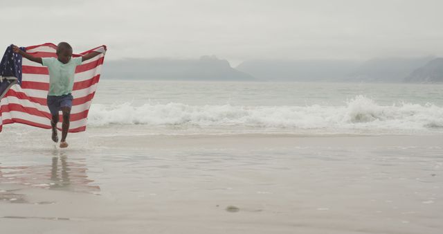 Child Running on Beach Holding American Flag - Download Free Stock Images Pikwizard.com
