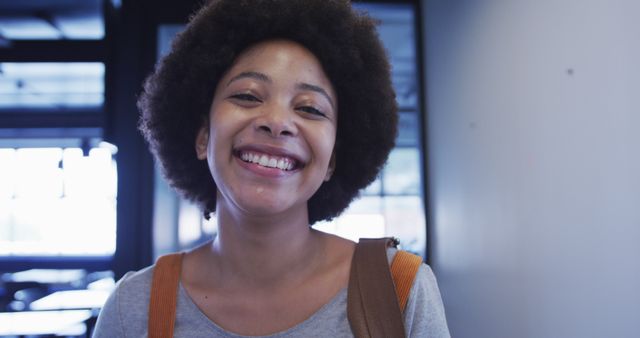 Smiling African American Woman Exuding Positivity in Casual Setting - Download Free Stock Images Pikwizard.com