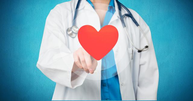 Female Doctor Touching Red Heart Shape - Download Free Stock Photos Pikwizard.com